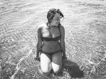 Young woman in bikini on beach