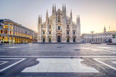 Milan cathedral against sky during sunset