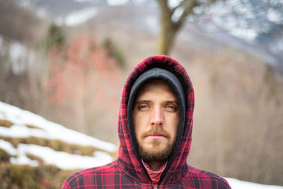 Portrait of young man looking at camera