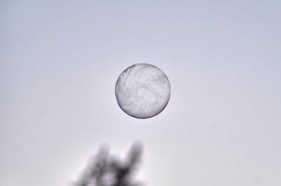 Low angle view of moon against clear sky