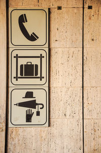Signs for telephone, luggage claim and personal objects in firenze train station, italy