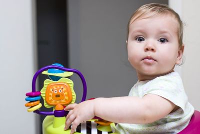 Portrait of cute boy with toy