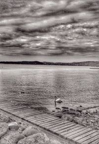 Scenic view of sea against cloudy sky