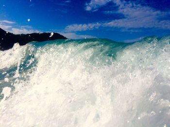 Scenic view of sea against blue sky