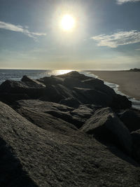 Scenic view of sea against sky at sunset