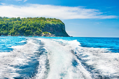 Scenic view of sea against blue sky
