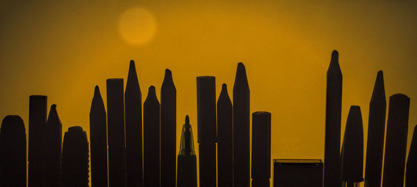 Low angle view of yellow cactus against sky during sunset
