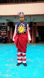 Portrait of boy wearing malaysian flag costume