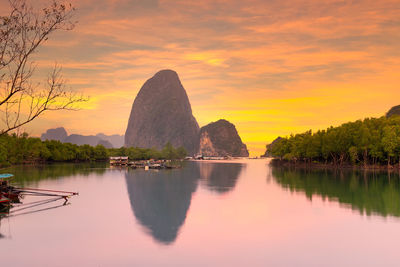 Scenic view of rock formation against sky during sunset