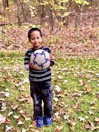 Portrait of girl standing on field