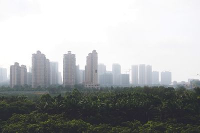 View of modern buildings against clear sky