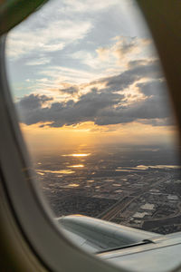 Aerial view of sky seen through airplane window