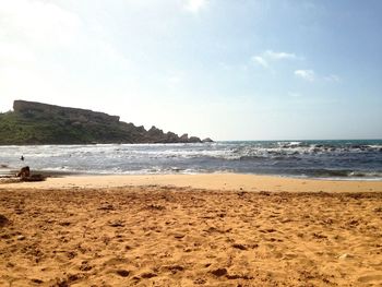 Scenic view of beach against sky