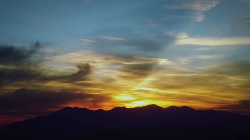 Scenic view of mountains at sunset