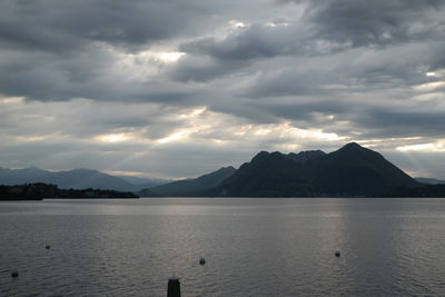 Scenic view of mountains against cloudy sky