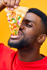 Side view of man holding food