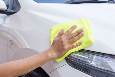 Midsection of woman in car