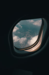 Reflection of sky seen through airplane window