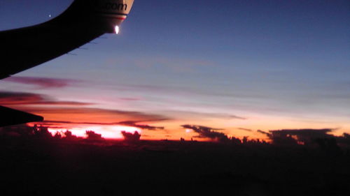 Scenic view of silhouette landscape against sky at sunset