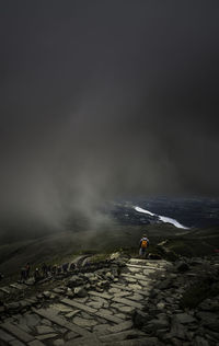 Hikers at snowdonia national park during foggy weather