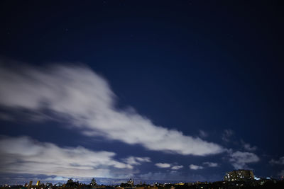 Low angle view of trees against sky at night