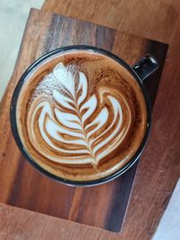 High angle view of cappuccino on table