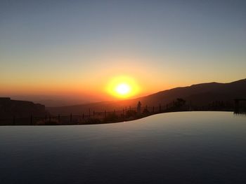 Scenic view of landscape against sky during sunset