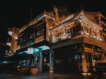 Low angle view of illuminated building at night