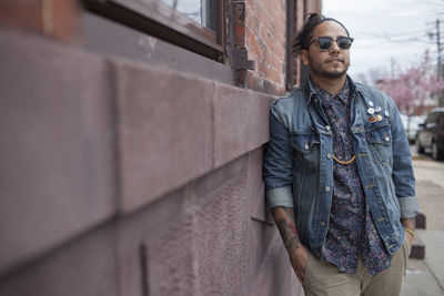 A young man on a sidewalk.