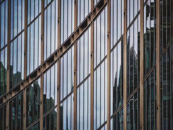 Full frame shot of glass building with reflection