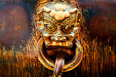 Close-up of metal sculpture on door