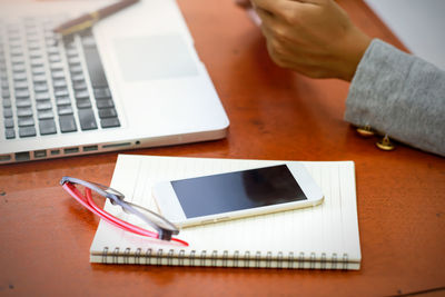 High angle view of using laptop on table