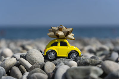 A car standing on the stones on the beach