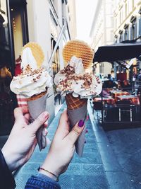 Couple holding ice creams