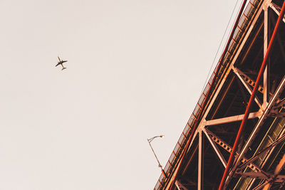 Low angle view of airplane flying in sky