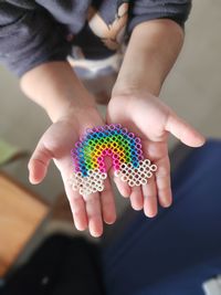 Cropped hand of woman holding crystal ball