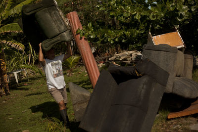 Man sitting on chair in yard