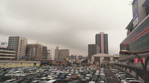 Cars parked on sidewalk in city