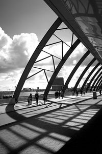 People walking on bridge in city