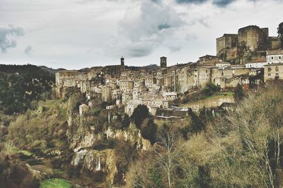 Buildings against cloudy sky at sorano