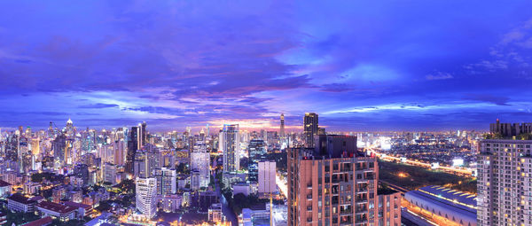 High angle view of illuminated buildings against sky