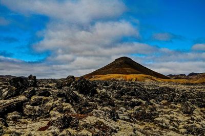 Panoramic view of arid landscape against sky