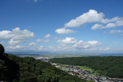 High angle view of landscape and sea against sky