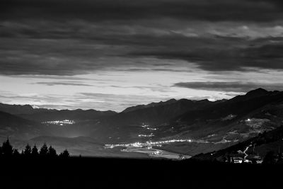 Scenic view of silhouette mountains against sky