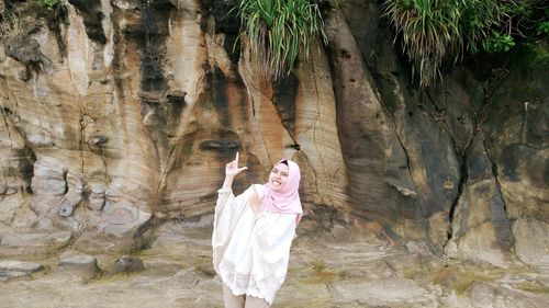 Woman standing on rock