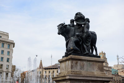 Low angle view of statue against sky