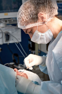 Side view of doctor examining patient