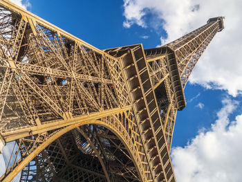 Low angle view of tower against cloudy sky