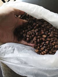 Close-up of hand holding coffee cup