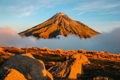 Scenic view of volcanic mountain against sky